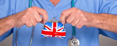 Holding small British flag