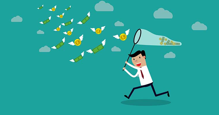 Businessman chasing flying money