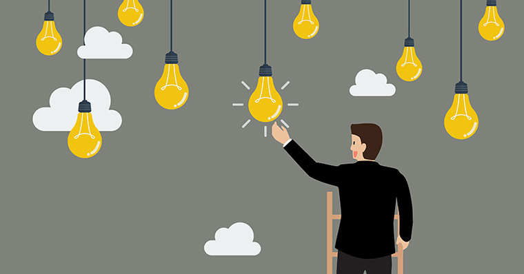 Businessman ladder light bulbs