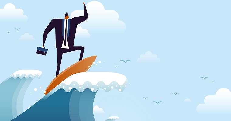 Businessman riding wave
