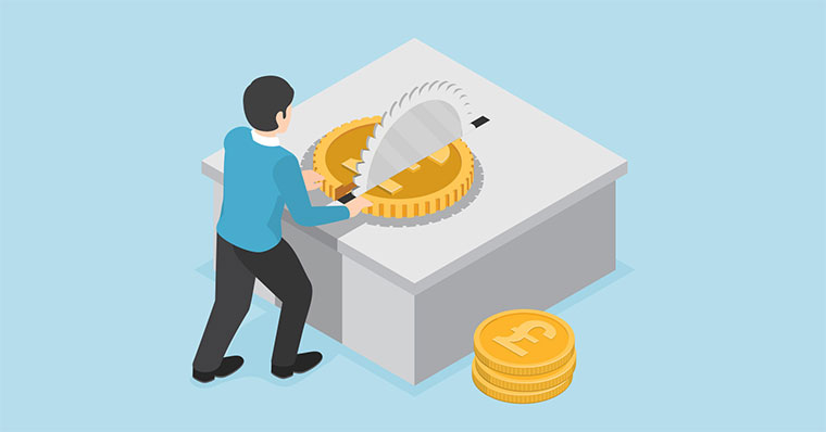 Man cutting coin with table saw