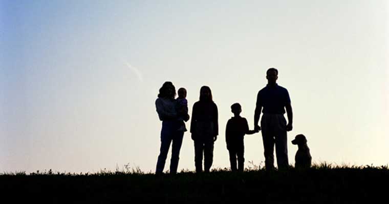 Family in profile looking at the view Family in profile looking at the view