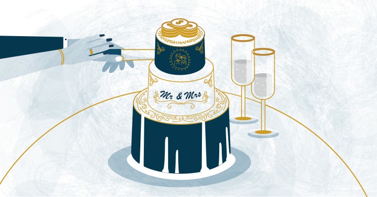 A couple cuts their destination wedding cake