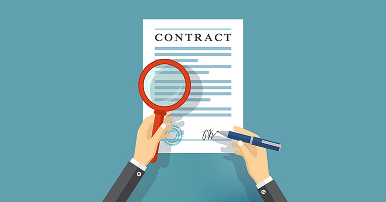 A magnifying glass over a contract