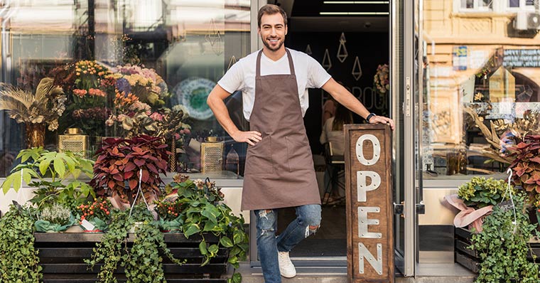 man in front of shop