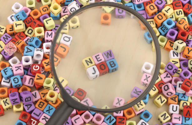 New job lettering Letters spelling out new job under magnifying glass
