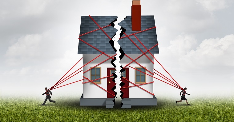 Property feud Two people breaking a house into two pieces