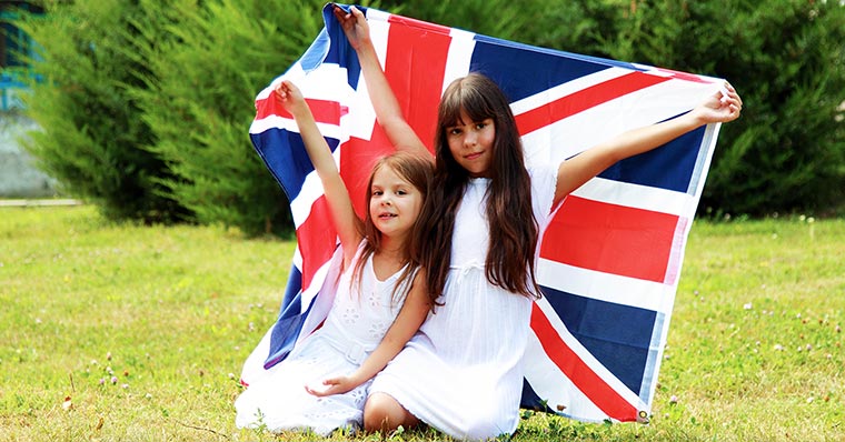 Two children holding UK flag